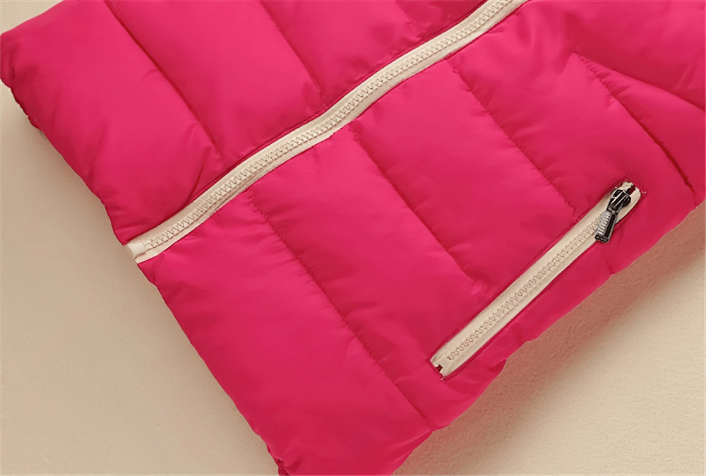 Close-up of a vibrant pink casual zipper hooded down vest with visible zip detail, made from cotton and polyester for warmth and comfort.